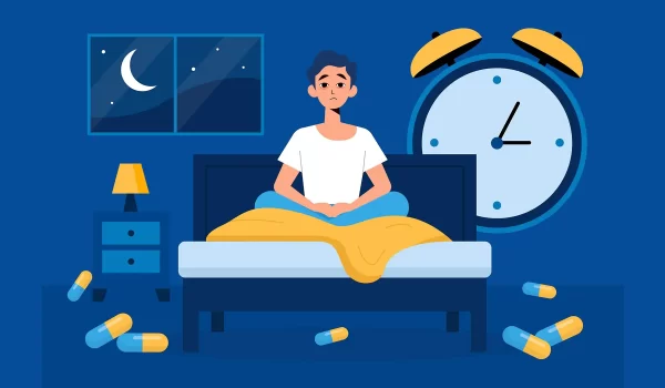 فردی بی‌خواب نشسته بر روی تخت